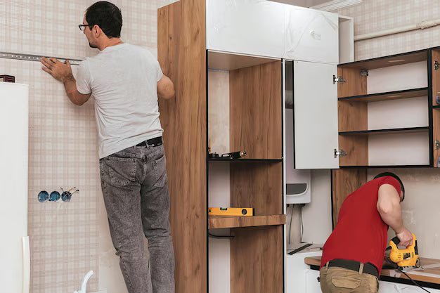 Craftsmen installing kitchen